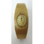 Omega. A Ladies 9ct gold wrist watch with original box and papers circa 1976