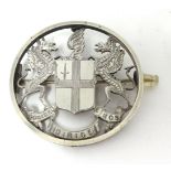 A silver brooch with crest depicting the Latin motto of the City of London 'Domine dirige no's',