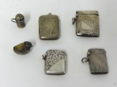 Three silver match vesta's, a miniature silver pepper pot, a silver quail pin cushion and an EP