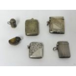 Three silver match vesta's, a miniature silver pepper pot, a silver quail pin cushion and an EP