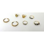 An 18ct gold three stone diamond Ring, illusion set , four dress Rings and a pair of hoop