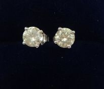 A pair of diamond ear studs, approx 1.00 ct , total weight, approx colour G, approx clarity SI1