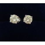 A pair of diamond ear studs, approx 1.00 ct , total weight, approx colour G, approx clarity SI1