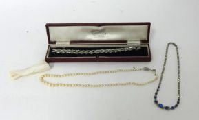 A single row graduated cultured pearl Necklace, a paste set necklace and a paste set bracelet.