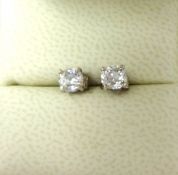 A pair of Victorian single stone diamond Earstuds, claw set with old cut stones weighing