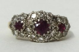 18ct yellow gold ruby and cluster ring, size G1/2.