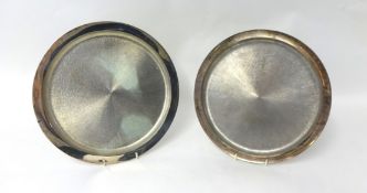 A pair of matching silver salvers with plain polished borders and bark finished centres by House
