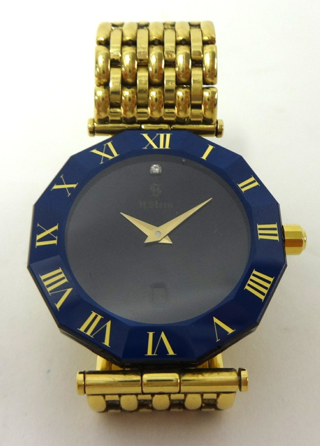 H. Stern. A gentleman's 18ct gold and diamond set quartz Wristwatch, the octagonal synthetic