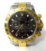 Rolex Daytona. A gold and stainless steel gentlemans Oyster Perpetual Cosmograph Wristwatch, circa