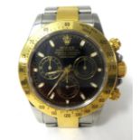 Rolex Daytona. A gold and stainless steel gentlemans Oyster Perpetual Cosmograph Wristwatch, circa