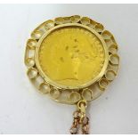 A Victoria gold sovereign, 1877, mounted in a pendant on fine chain.