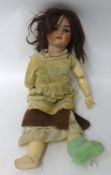 A Simone Halbig bisque head doll with open eyes and mouth, height 51cm.
