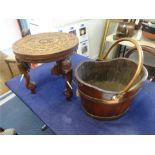 An old wood and copper bound bucket t/w an Indian occasional carved hardwood table with elephant