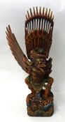 An Indian carved and painted wood Garuda bird statue, 75cm tall.