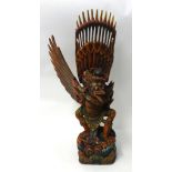 An Indian carved and painted wood Garuda bird statue, 75cm tall.