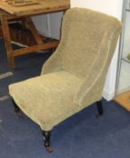 An upholstered Edwardian nursing chair.
