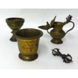 An antique brass Indonesian mortar, a goblet and two other items (4).