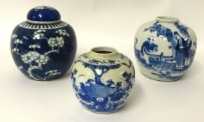 A Chinese blue and white ginger jar and another smaller decorated with trees and plants (2), tallest