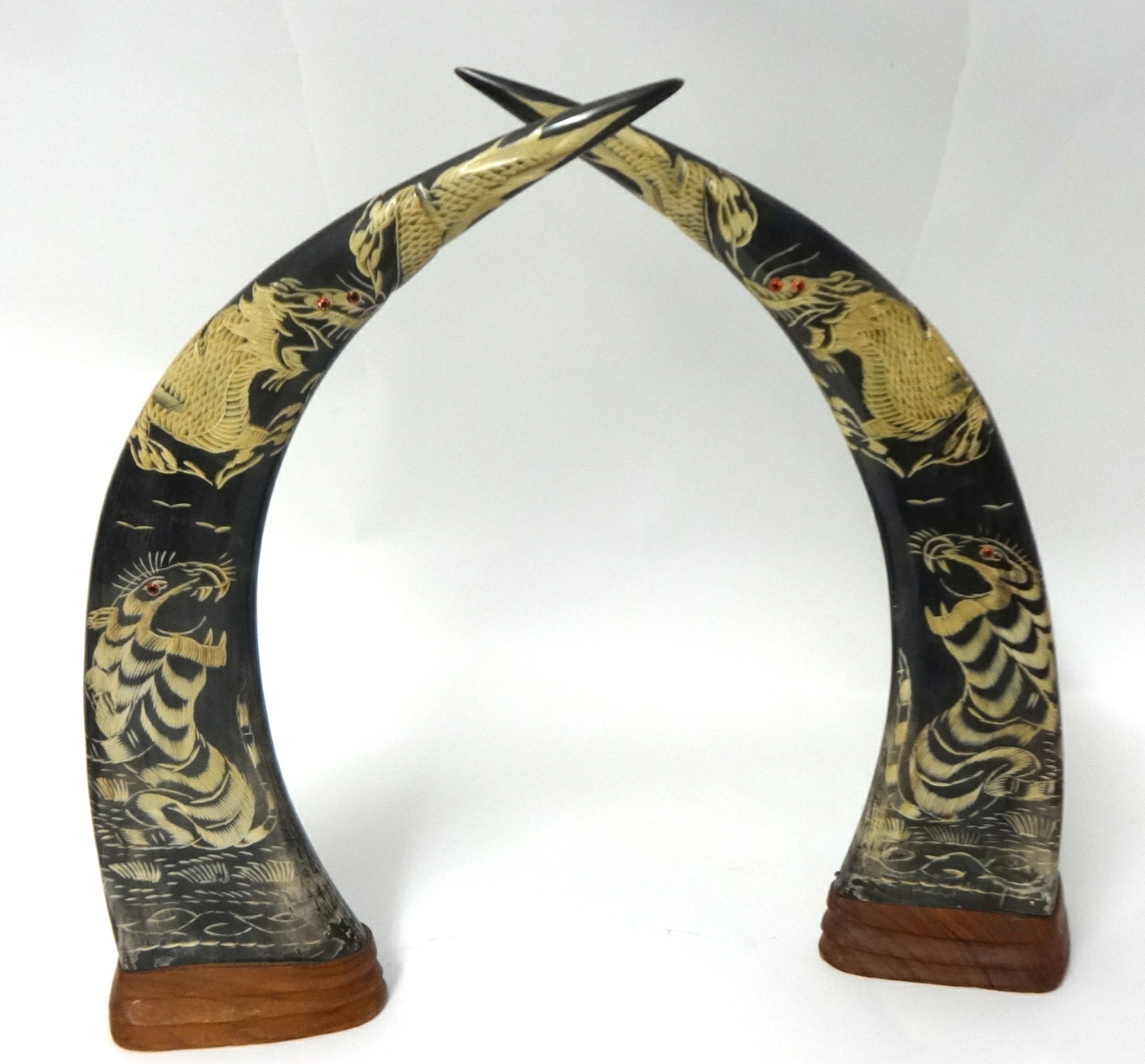 A pair of Ornamental carved wood 'tusks', 42cm high.