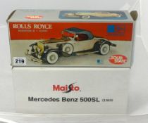A boxed Maisto Mercedes Benz 500 SL and boxed Harvard 'Rolls Royce Radio'