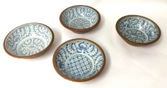 Set of four 'Kitchen Qing' domestic earthen ware blue and white bowls, 27.5cm diameter.