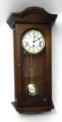 A reproduction wall clock, Benson with key, 67cm tall.