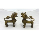 Pair of Chinese dog ornaments, height 10cm.