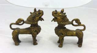 Pair of Chinese dog ornaments, height 10cm.