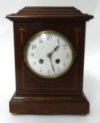 An Edwardian mantle clock with inlaid mahogany case, gong striking movement and key, 27cm