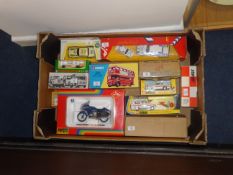 A tray of miscellaneous boxed toys and kits including Corgi Police vehicles and Route master bus