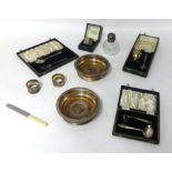 A pair EP wine bottle coasters, a silver egg cup and spoon set, cased, a silver heavy and engine