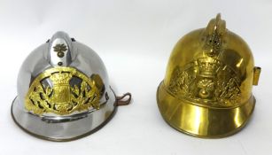 Two French fire helmets, one silver, one brass