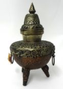 A mixed metal Asian centre piece with pierced decoration and cover, height 30cm.