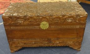 An Indonesian carved camphor wood blanket chest, height 60cm x width 100cm x depth 48cm.