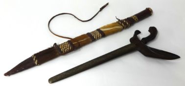 An Indonesian Kris, a Khukri and a tribal short sword with animal skin scabbard (3)