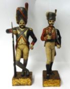 Pair of 20th century carved wood figures of Russian Infantry men, height 56cm (2).