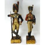 Pair of 20th century carved wood figures of Russian Infantry men, height 56cm (2).