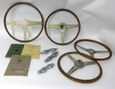 Four steering wheels for 'Jaguar' cars and various mascot