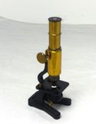 A brass 'Household Microscope', boxed.
