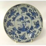Chinese blue and white porcelain shallow dish decorated with panels of stylised flowers, 21cm