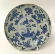 Chinese blue and white porcelain shallow dish decorated with panels of stylised flowers, 21cm