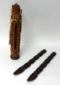 An Indonesian carved wood door chime and a carved rosewood fork and spoon, 56cm.