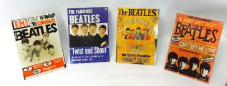Four reproduction Beatles poster signs