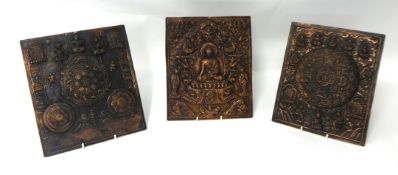 Three Tibetan copper calendars, each approximately 30cm x 25cm.