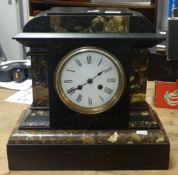 Victorian slate and marble mantle clock with bell strike and eight day movement.