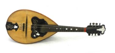 An old mandolin, cased with paper label 'Giode Meglio', Italy.