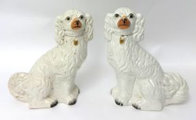 A pair of Victorian Staffordshire dogs, height 33cm.