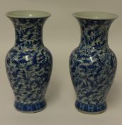 A pair of reproduction Chinese blue and white vases.