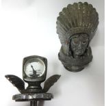 Two vintage radiator caps including 'Feather in Our Cap Guy Motors Ltd' and a calor meter by