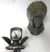Two vintage radiator caps including 'Feather in Our Cap Guy Motors Ltd' and a calor meter by